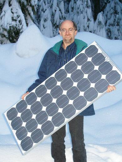 Peter holding an 80 watt Siemens solar module