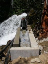 A coanda screen and drop type intake supplies 50 liters per second to a 6 inch penstock, 6000 feet long with 1500 feet of total fall.