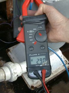 Clamp on DC meter reading 29 amps at 28 volts, for 812 watts of clean micro hydro energy..