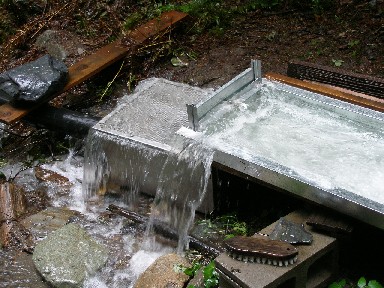 A stainless steel box and screen serves at the intake.