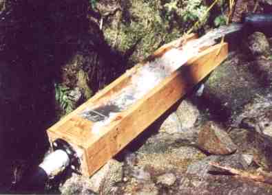 A portable self cleaning intake built into a wooden floom.