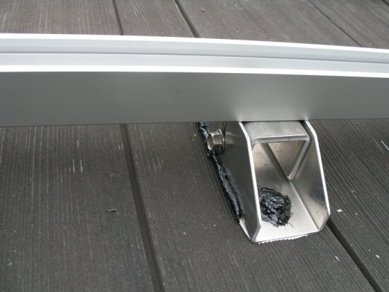 Rail roof mounting feet caulked